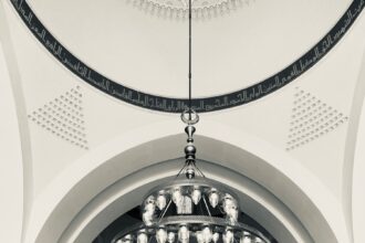 a group of people standing in a large building